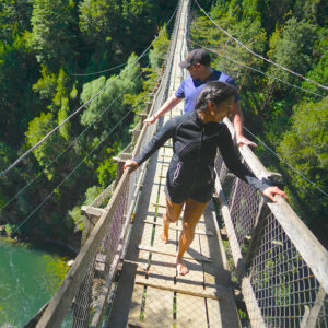 Hiking in Pucon Chile over a drawbridge